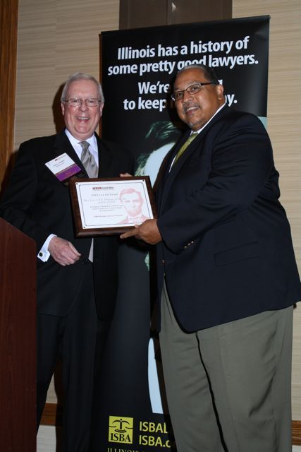 President O'Brien presents the award for Best Live CLE Program to Health Care Section chair Michael Daniels