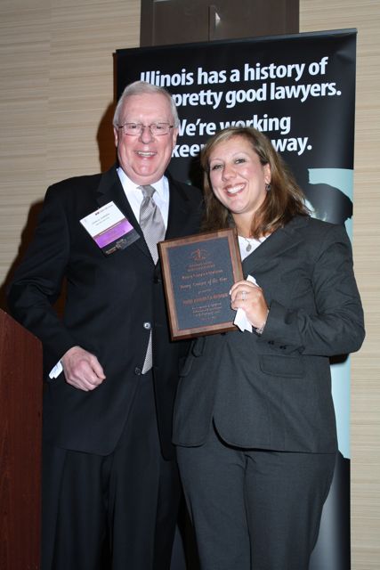 President O'Brien presents an ISBA Young Lawyer of the Year Award to Gina Arquilla DeBoni
