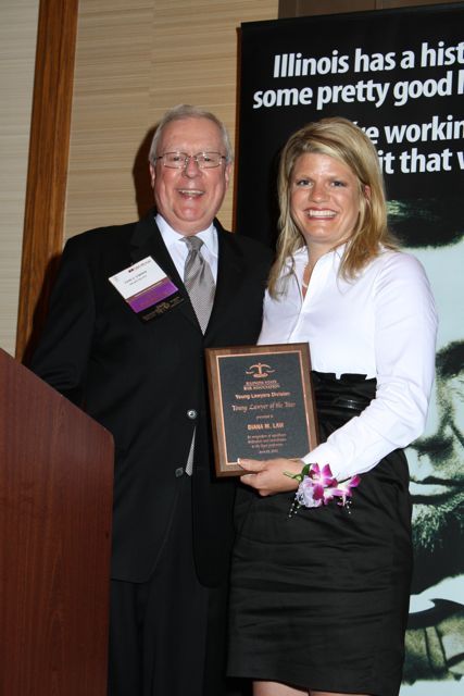 President O'Brien presents an ISBA Young Lawyer of the Year Award to Diana M. Law