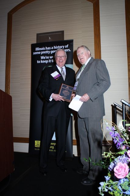 President O'Brien presents a Board of Governors Award to Hon. Alexander P. White