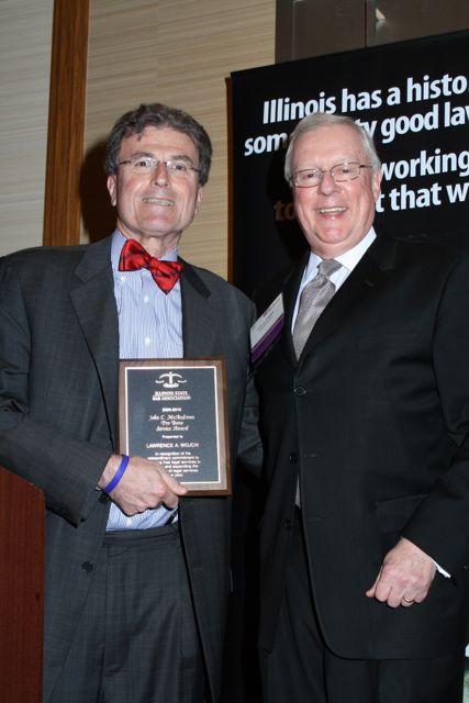 President O'Brien presents a John C. McAndrews Pro Bono Service Award to Lawrence Wojcik
