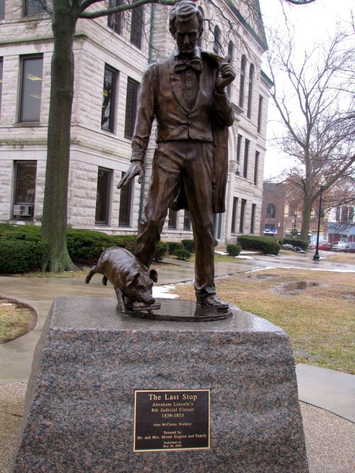 Click to enlarge: The Lincoln and pig statue that sits on the courthouse lawn stems from Lincoln's famous "Writ of Quietus" asking the judge to silence the serenade of pigs from under the courthouse.
