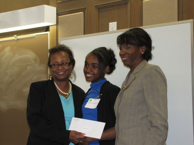 Buford and Perkins present the 3rd place award to Quinnyata Bellows.