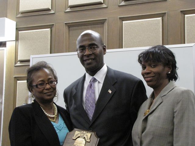 Andrea Buford (left) and Marian Perkins (right) present Martin Greene with a Law Day Award.