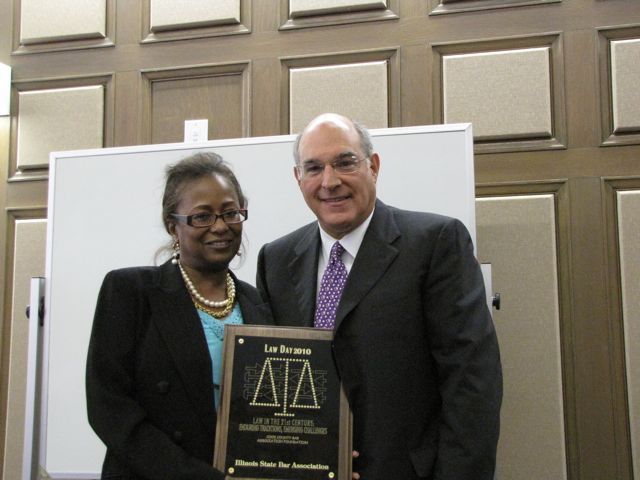 Andrea Buford presents a Law Day award to the ISBA and President-elect Hassakis