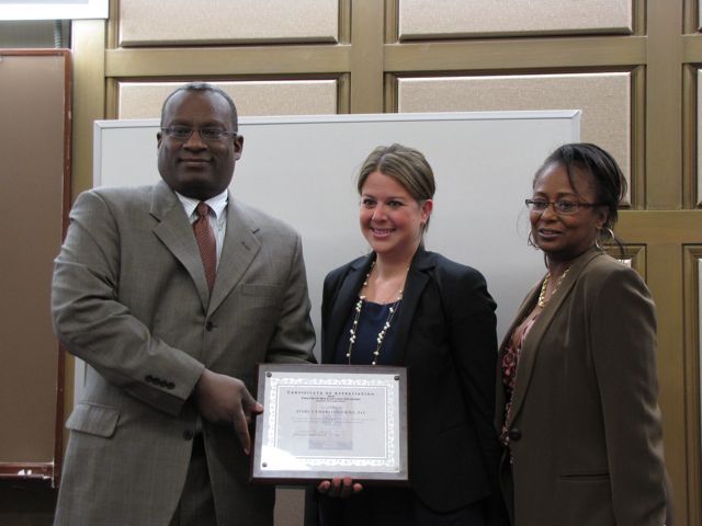 CCBA President Lawrence Hill and CCBF President Angela Buford (right) present Rebecca E. Cahan an award for her firm's support of the Law Day Luncheon.