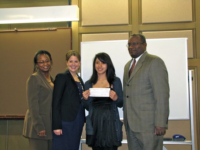 Angela Buford, Rebecca Cahan and Lawrence Hill present a check to 2nd place essay winner Gisel Bahena.