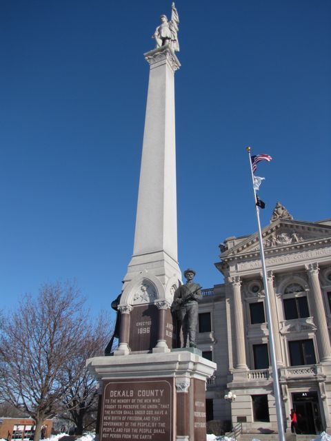 The Civil War monument towers in front of the courthouse.