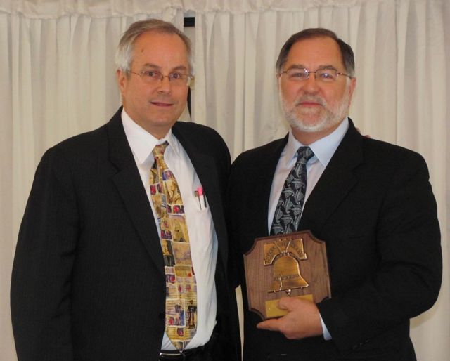 Jim Reichardt congratulates the 2010 Liberty Bell Award winner, ISBA Executive Director Bob Craghead. The DCBA presents the LIberty Bell Award annually to a non-lawyer for contributions to the law in observance of Law Day.