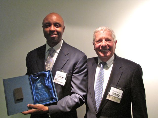 IBF President and charter member Vince Cornelius receives his charter member plaque from IBF Immediate Past President David Sosin.