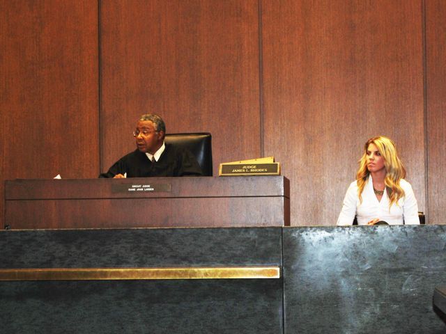 Judge James Rhodes presides over a trial.