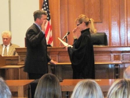 Chief Judge Ann Callis swears in William Mudge as a circuit judge at the Madison County Courthouse on Monday.