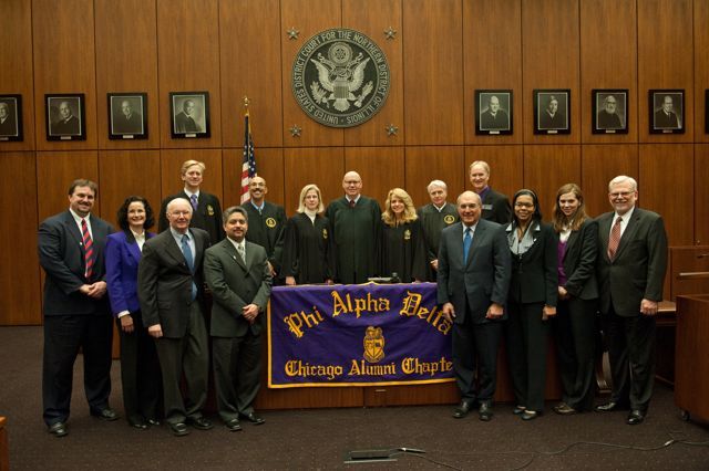The Chicago Alumni Chapter recently initiated 8 prominent attorneys who pledged to uphold the fraternity's mission of service to the student, the school, the profession and the community. The new initiates are in the front row, l to r:  Daniel Cotter; Jayne Reardon; Edward Andersen; Enrique Abraham, President of the Puerto Rican Bar Association; Mark Hassakis, President-Elect of the Illinois State Bar Association; Yolaine Dauphin; Laura Milnichuk; Alfred Swanson, Jr. Back row, l to r: Kevin Hull, Pierre Priestley, Nicole Kopinski, Chief Judge Holderman, Michele Jochner, Bob Downs, John Norris.