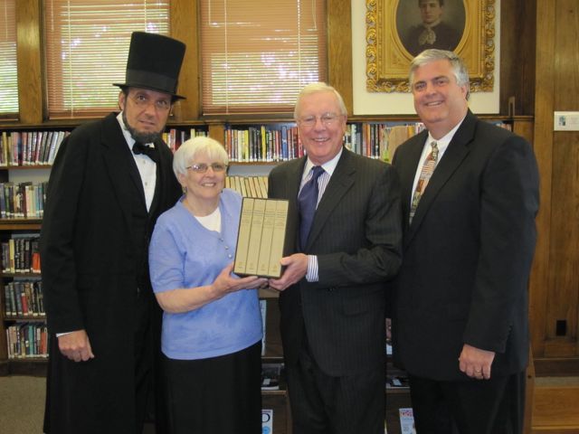 President John O'Brien presents the "Papers of Abraham Lincoln" to the Belvidere Library.