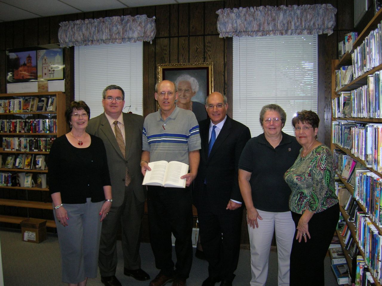 ISBA President-elect recently presented the Carlyle library with "The Papers of Abraham Lincoln." On hand for the presentation were (left to right): Barbara Guebert, Board of Trustees; John A. Hudspeth Jr., State's Attorney; Jim Roeckeman, Library Director; Mark D. Hassakis; Sue Largent, Carlyle High School teacher; Sharon Berdeaux, President Board of Trustees  