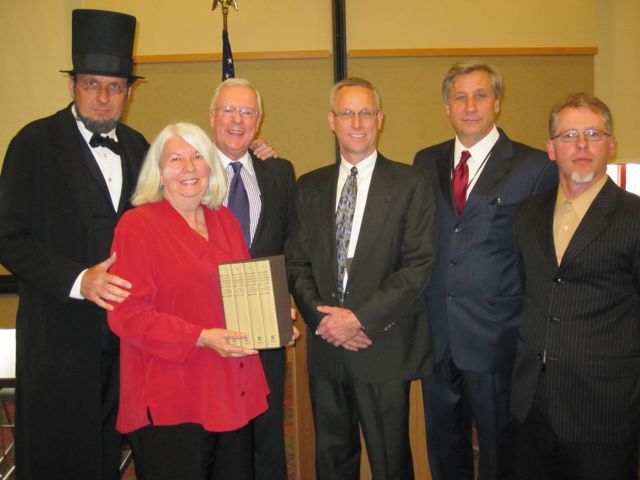 ISBA President John O'Brien present to the "Papers of Abraham Lincoln" to the Freeport Library.