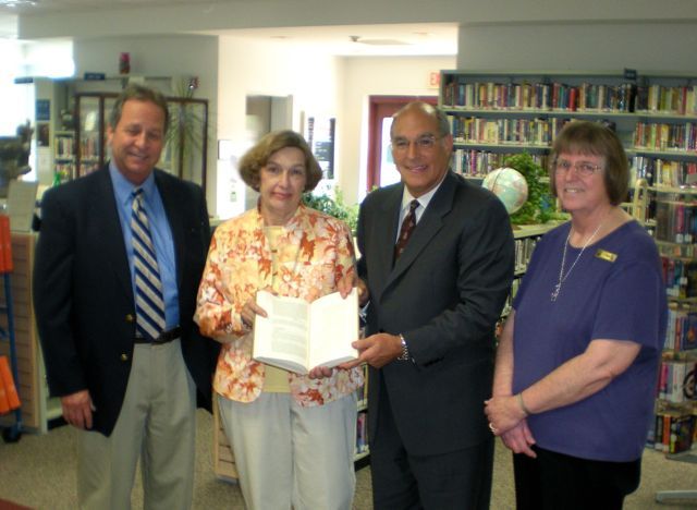 ISBA President-elect Mark Hassakis presented "The Papers of Abraham Lincoln" to the Harrisburg library on May 25. On hand for the presentation were: Hon. Bruce Stewart, Library Trustee Lynda Clemmons, President-elect Hassakis and Children's Librarian Kae McCue.