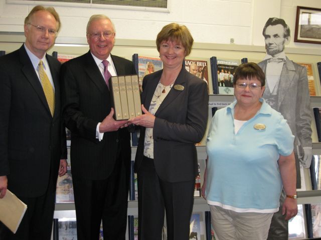 Illinois Supreme Court Justice Thomas Kilbride joins ISBA President John O'Brien in presenting the four-volume set to Galesburg Public Library Director Pam Van Kirk and archivist Patty Mosher.