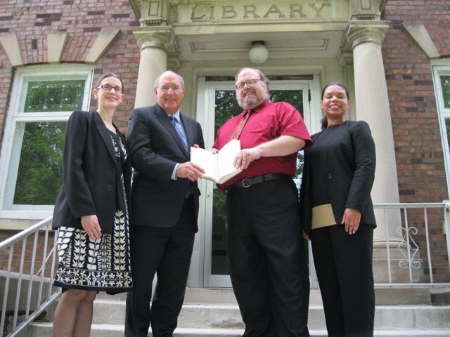 President-elect Mark Hassakis presents the "Papers of Abraham Lincoln" to the Mount Vernon Library. On hand for the event were (left to right): ISBA member and Mt. Vernon attorney Julie Quinn, President-elect Hassakis, library director Bill Pixley, ISBA member and Mt. Vernon attorney Sonja Ligon.