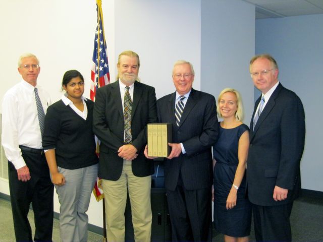 ISBA President John O'Brien presented "The Papers" to the Peoria Heights library on Wednesday, May 26. On hand for the presentation were (left to right): Tim Cassidy of Cassidy & Mueller; Lisa Joseph and Phil Lenzini of Kavanagh Scully Sudow White & Frederick; ISBA President O'Brien; Elizabeth Jensen, also of Kavanagh Scully and a member of the ISBA Board of Governors; and Justice Thomas Kilbride