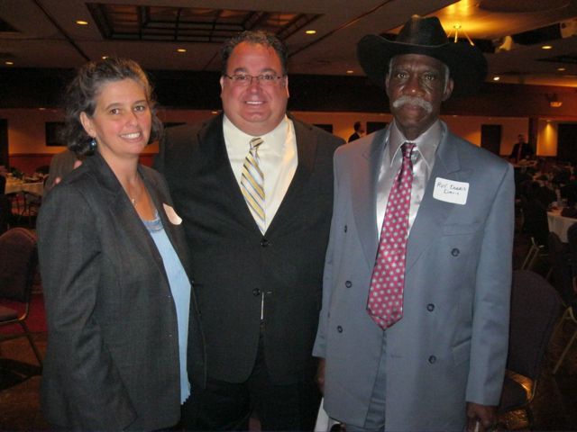  St. Clair County Bar president Kevin Hoerner congratulates Sheila Burton, recipient of the Hudlin Memorial Award recognizing outstanding community service by a lawyer, and Rev. Dorris Davis. Burton created and operates Join Hands ESL, which mentors impoverished children in East St. Louis. Rev. Davis operates a shelter for homeless men in East St. Louis.