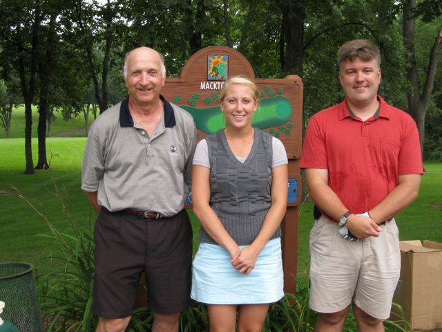 Bill Howard, Jennifer Speckman and Rob Torbert get ready to tee off