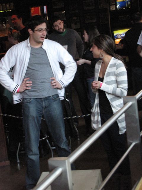 Two opponents get ready to square off at bags