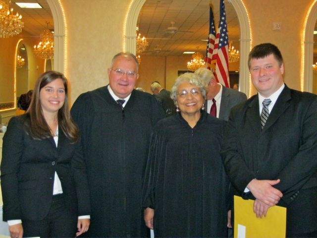 New admittee Jessica Fiocchi, Justice Robert L. Carter, Justice Mary McDade and new admittee Brandon Brown