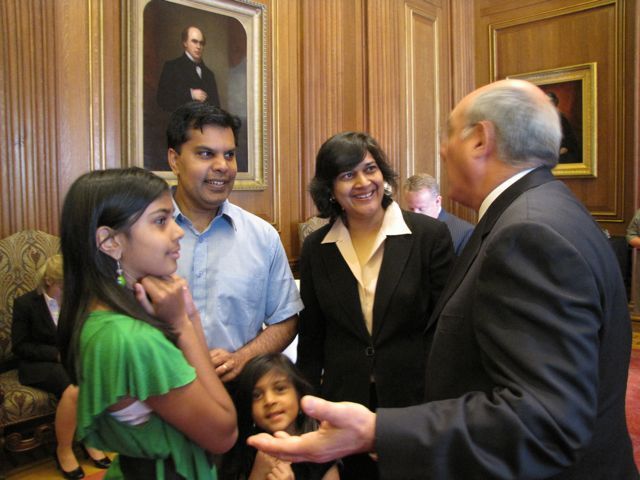 ISBA President Mark D. Hassakis meets with new admittee Sonali Sinha Srivastava and her family