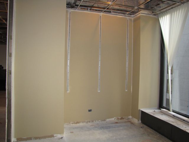 One wall of this office has been painted.