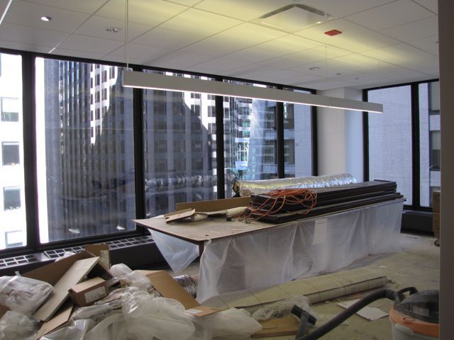 Ceiling tiles and lights are ready in the library/conference room.