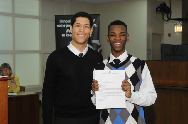 Teacher Phillip Rutherford presents the Leadership Award to David McNeal