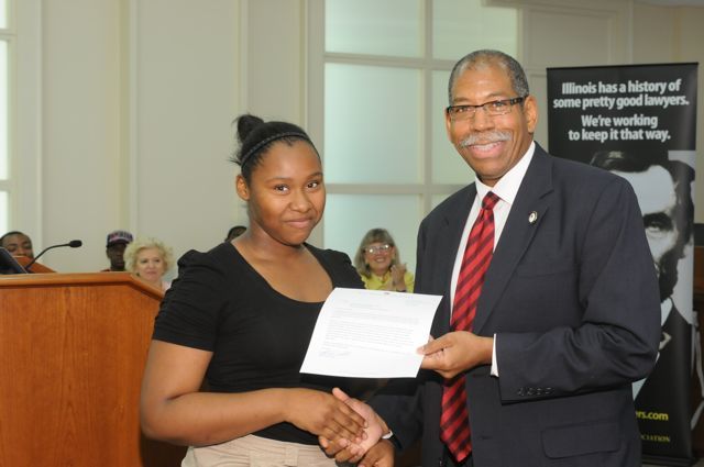 Ashley Phillips receives a Moot Court Award from Dean Smith