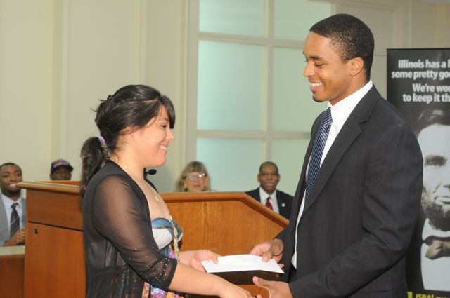 Teacher Terrance Garmon presents the Lincoln Award ($150 cash, $5,000 John Marshall tuition waiver) to Esperanza Gaytan