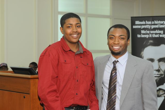 Sidney Butler (left) accepts the Thurgood Marshall Award from teacher Tyreese Foreman