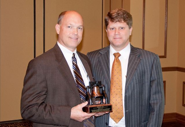 Alton Police Chief David Hayes receives the Liberty Bell Award from Madison County Bar Association President John Stobbs at the May 2 Law Day event.