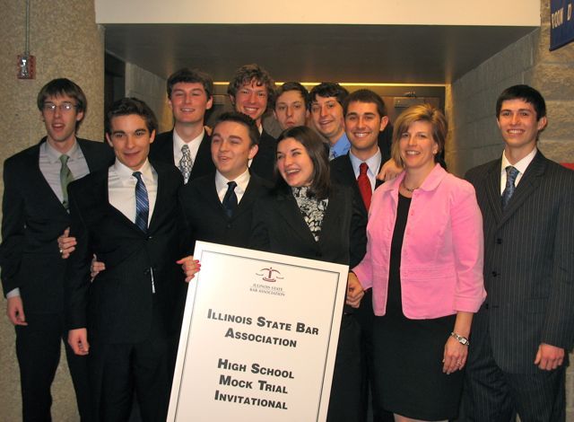 The winners of the 2011 ISBA High School Mock Trial Invitational, Chatham Glenwood High School. Front (left to right):  Ben Shane, Samuel Adkisson, Kelly Franklin, Coach Christine Self, Zane Carmean; Back (left to right):  Jansen Eaton, Luke Folkerts, Travis Farris, Tylar Midden, Skylar Midden, Quinn Marschik
