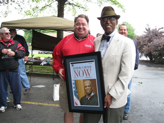 St. Clair County Bar President Kevin Hoerner and 20th Circuit Judge Milt Wharton admire the Illinois Lawyer Now Quarterly cover featuring Wharton from the Fall 2010 issue.