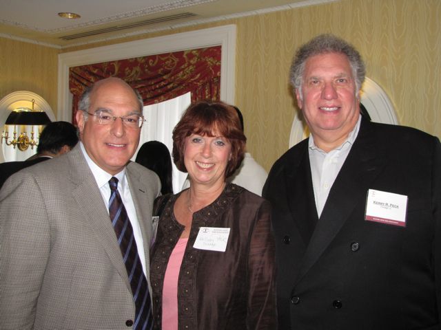 ISBA President Mark D. Hassakis with new admittee Kerry Peck and his wife, Hillary