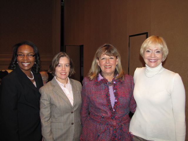 ISBA 2nd Vice President Paula H. Holderman (second from right) with friends at the reception.