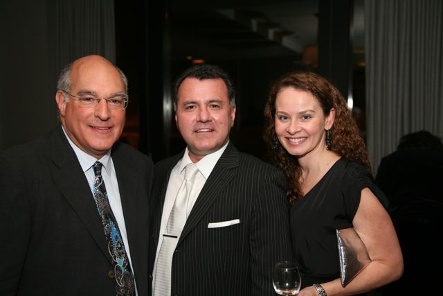 ISBA President Mark D. Hassakis with Rey and Leslie Galvan of Fidelity National Title