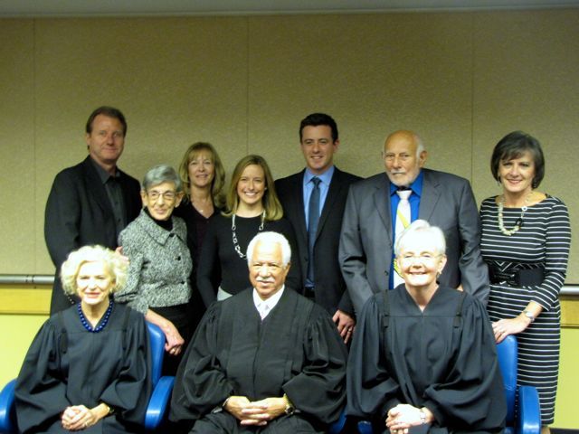 New admittee Jonathon Walton and family with Justices Burke, Freeman and Theis