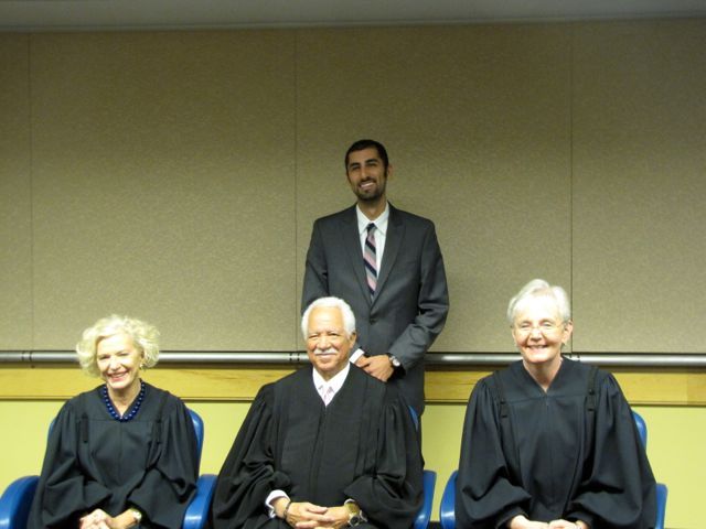 New admittee Andrew Bashi with Justices Burke, Freeman and Theis