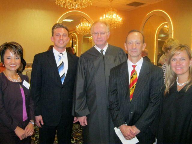 Speaker and ISBA Board member Sonni Williams, new admittee Carmen Rossi, Chief Justice Thomas L. Kilbride, father Judge Raymond Rossi and Judge Sara L. Darrow.
