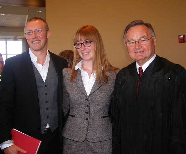 Pictured with new admittee Theresa Mohim are Jeff Carroll and Supreme Court Justice Lloyd A. Karmeier.