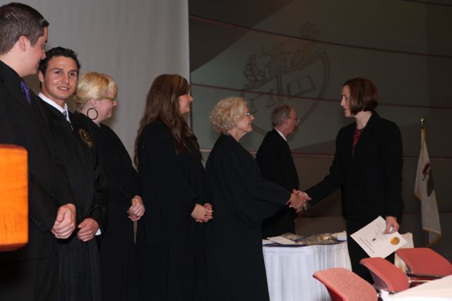 Illinois Supreme Court Justice Anne M. Burke and other members of the fraternity's leadership welcome Sidley & Austin partner Erin Kelly to the group.