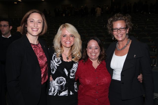 Michele Jochner (second from left) and Chicago Alumni Board member Deidre Baumann (second from right) welcome new members Erin Kelly and Kimberly Voichescu, a student at DePaul University College of Law.