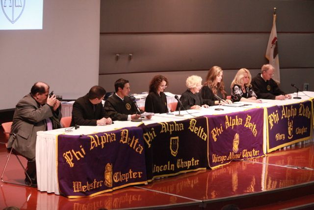 Illinois Supreme Court Justice Anne M. Burke and other Phi Alpha Delta leaders preside over the initiation ceremony.