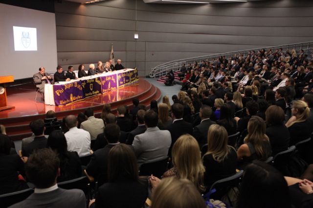 The new initiates hear about the principles of membership into the fraternity.