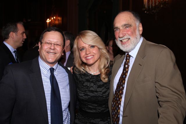 Michele Jochner (center) is congratulated by Jonathan Lowe and Warren Lupel.